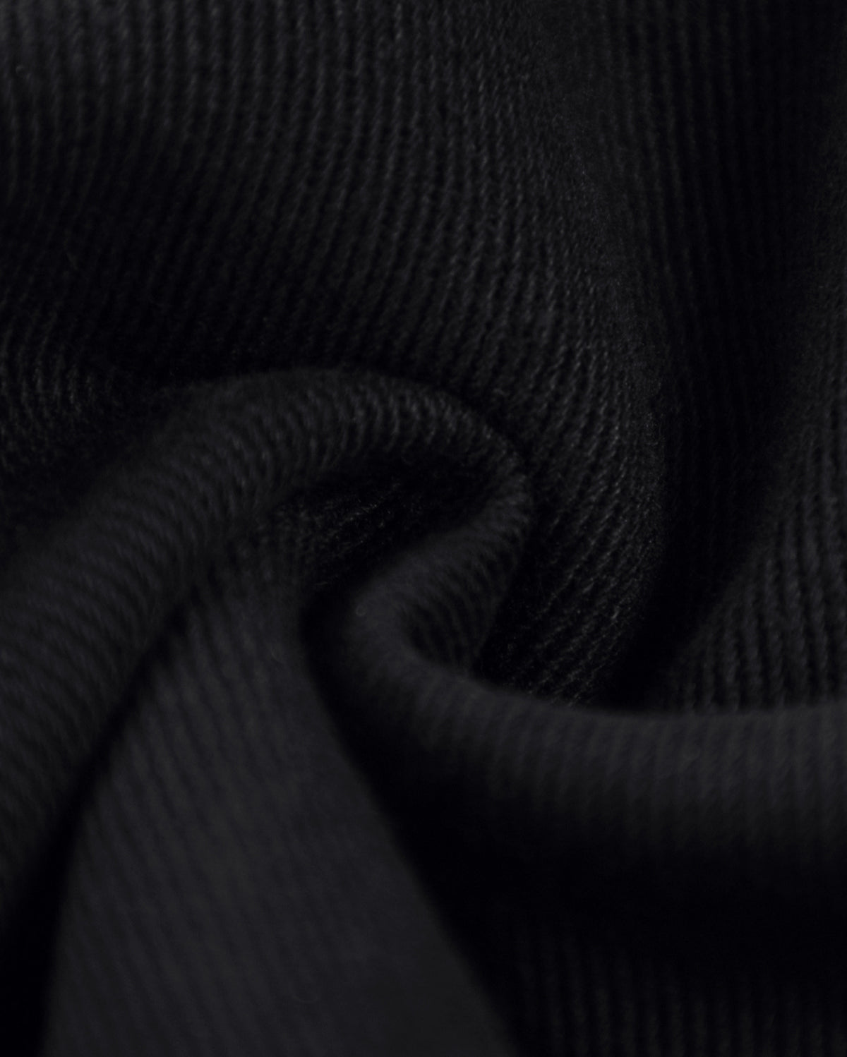     Close-up of black denim fabric texture used on Pastels & Pistols Rivet Denim Mini Skirt 