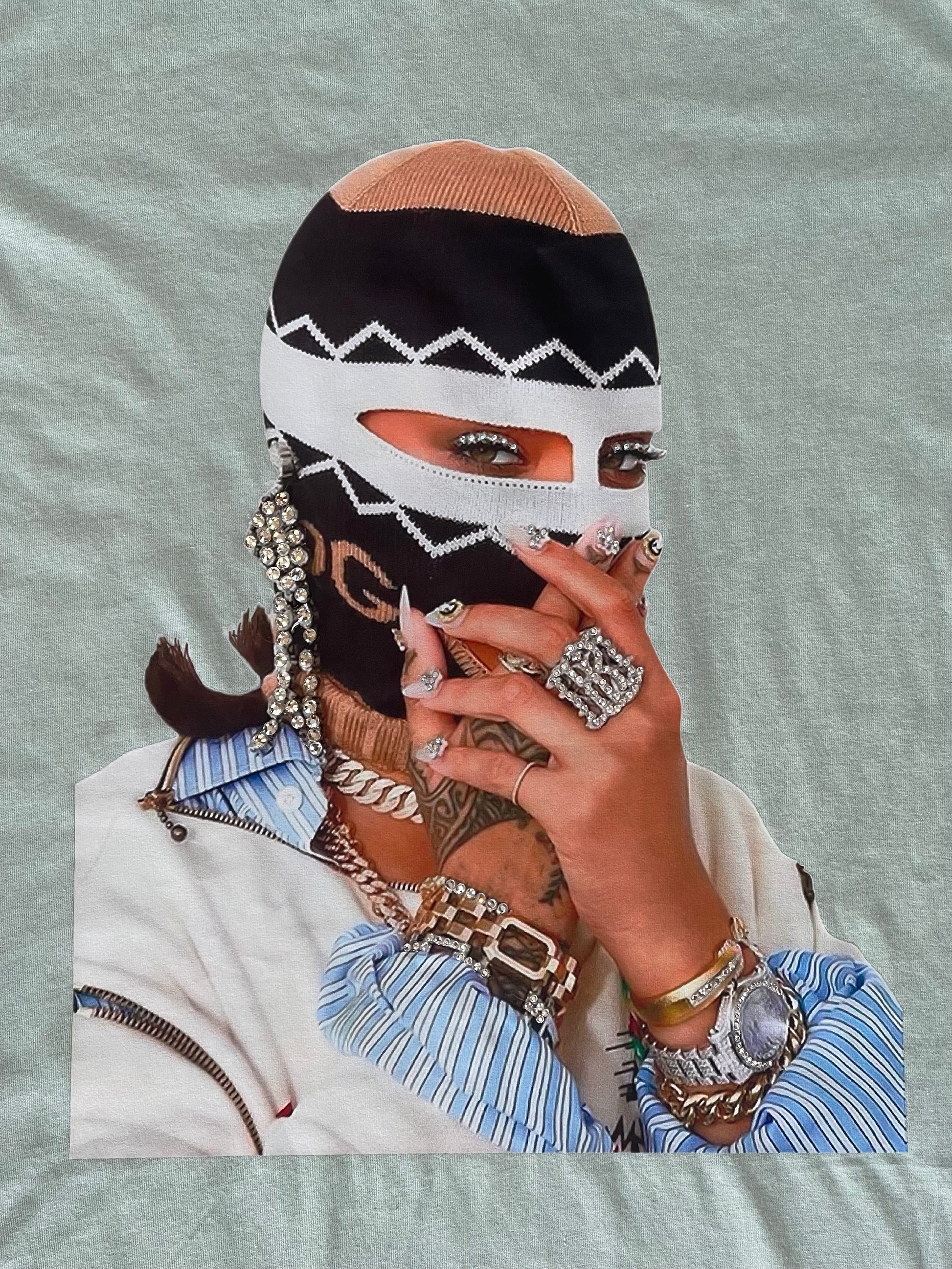 Close-up of the rhinestone-accented graphic on the seafoam green Pastels & Pistols “Say Less” Tee.