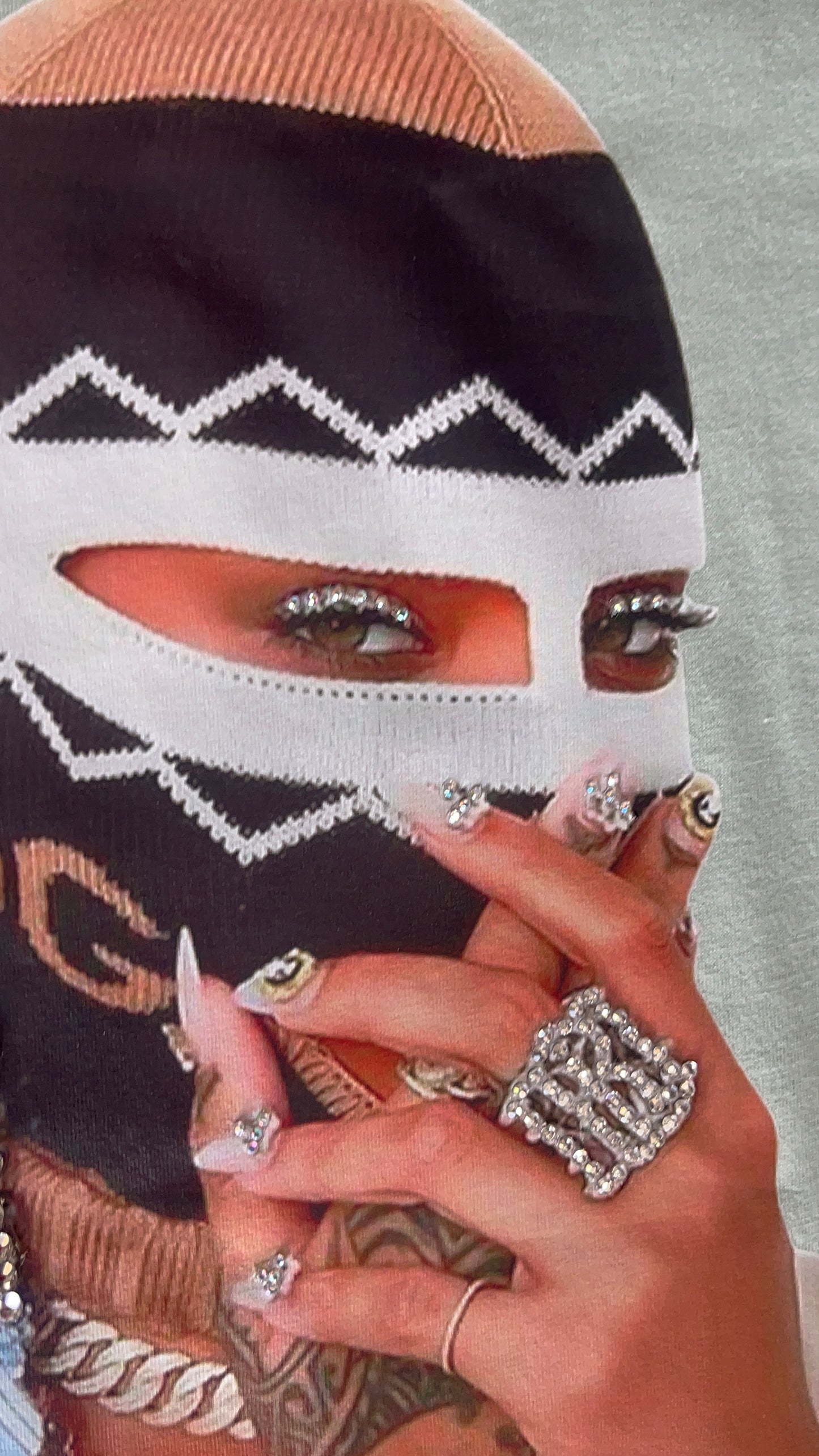 Close-up of eye section of the graphic with rhinestone accents on the Pastels & Pistols “Say Less” Tee.