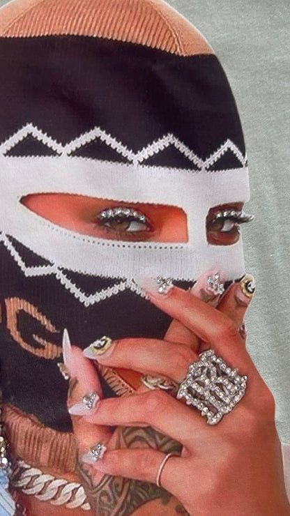 Close-up of eye section of the graphic with rhinestone accents on the Pastels & Pistols “Say Less” Tee.